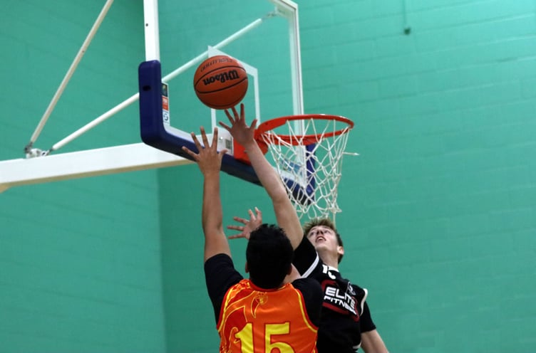 Cannons 'Jack Wilkinson reaches for the block against Jowi Szetu’s post move for Phoenix during their Senior League match at the NSC on Thursday evening (Photo: Brandon Bellew)