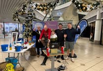 Friends take it in turns to cycle for 24 hours on exercise bike at shopping centre
