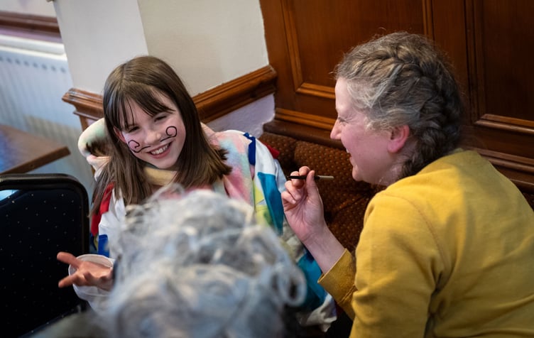 The White Boys' moustaches are drawn on