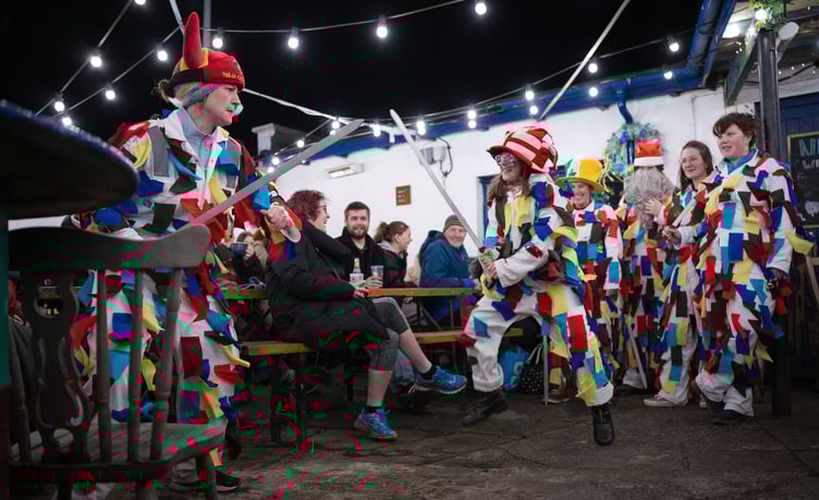 The White Boys perform Manx dancing in front of a crowd in Peel