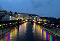 Pictures as historic pier bathed in a festive glow as lights switched-on