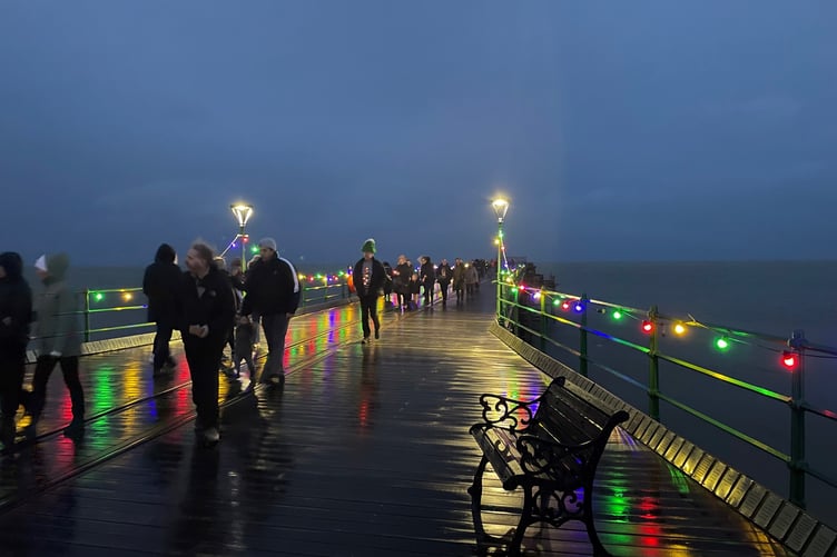 Visitors admire the Christmas lights on Queen's Pier in Ramsey