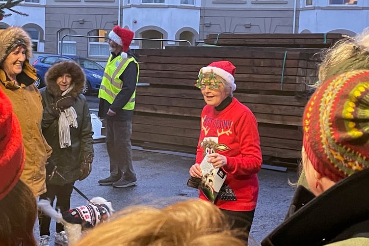 Manx Radio's Judith Ley entertains the crowds as she switches on the Queen's Pier Christmas lights