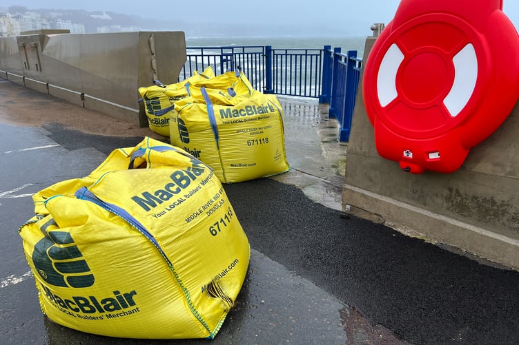 Sandbags in place at new sea wall's beach access