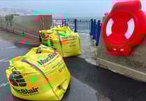 Pictures as sandbags replace capital's damaged new sea defences