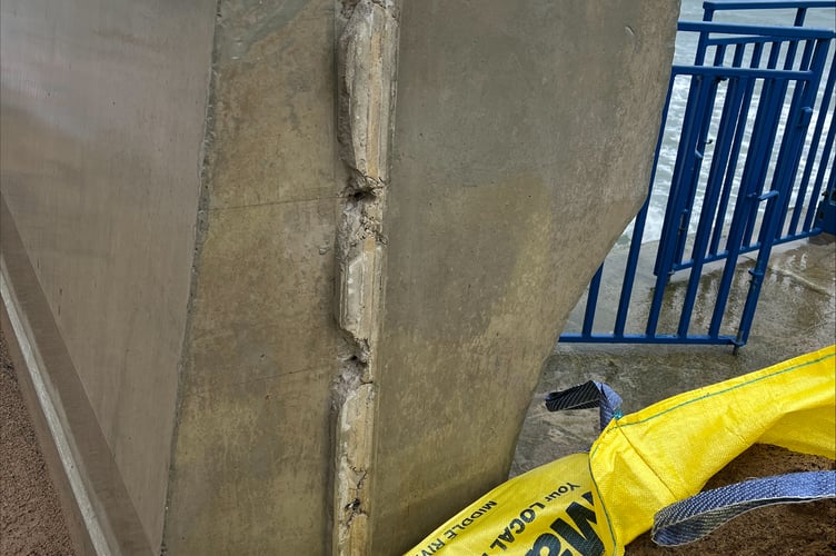 The fitting for the steel shutters has been stripped from the concrete wall