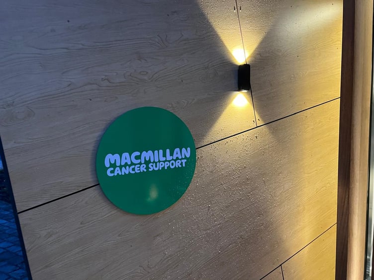 A Macmillan Cancer Support sign outside the front of the centre