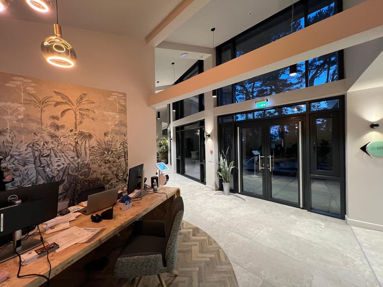 The reception desk leading towards the kitchen area