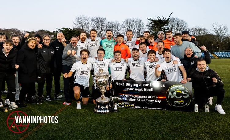 Corinthians players and coaches celebrate with the Railway Cup after beating Peel 2-1 in the Manx Car Store-sponsored final at the Bowl on Boxing Day (Photo: Gary Weightman)