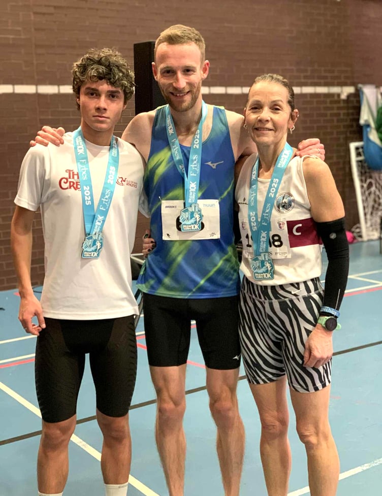 Ollie Lockley flanked by Corbyn Schade and Joanne Schade after all three Isle of Man athletes performed well at the Ribble Valley 10km road race recently