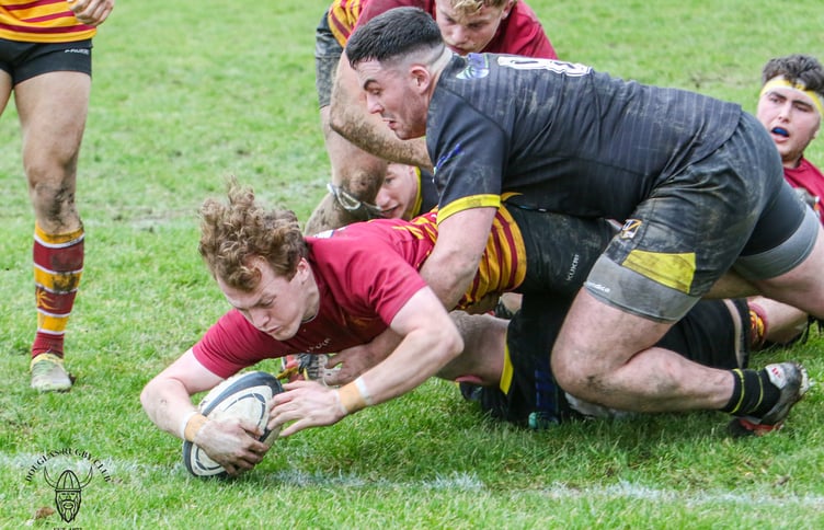 Kyle Martin dives over to score a try for Douglas against Burnage in a previous meeting between the two sides (Photo: Richard Ebbutt)