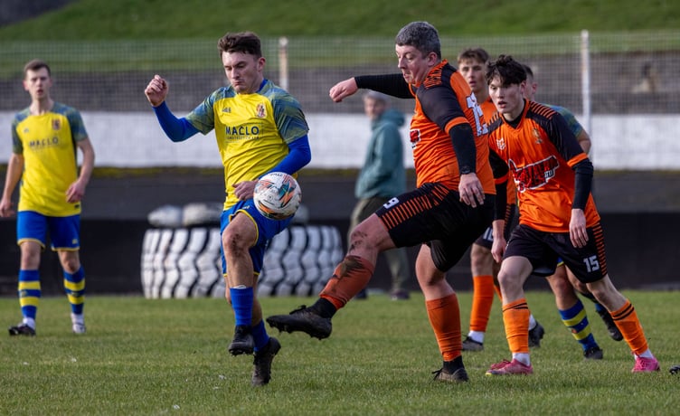 Andy Asbridge (left) scored twice for Onchan against Ste Barbour and Ayre United at the Nivison Stadium on Saturday afternoon (Photo: Gary Weightman)