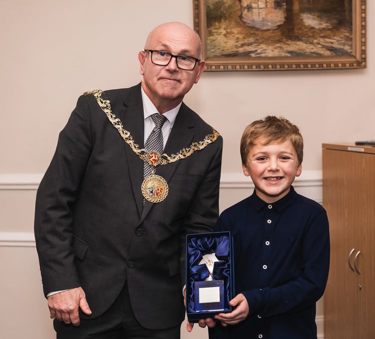 Logan Connor receives his award