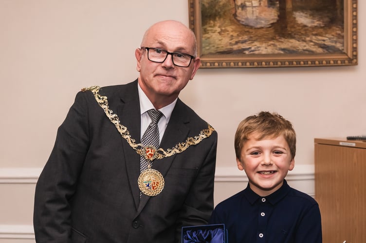 Logan Connor receives his award