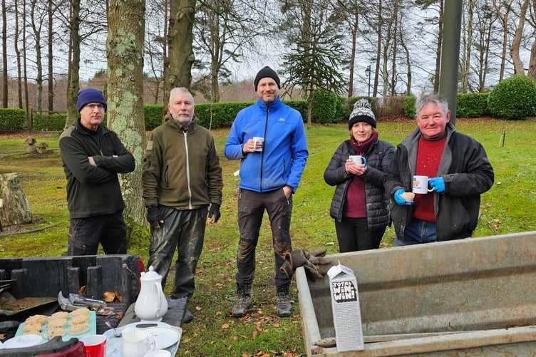 Volunteers enjoying some refreshments at Government House after their tree planting efforts