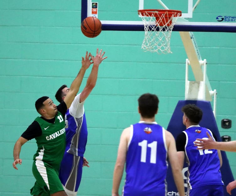 Wolves' Viktor Capkanovski releases the lay-up as Cavaliers Mike Lewis attempts to block his path to the basket. Capkanovski had a 43-point game in Wolves' 76-75 victory in the Senior League on Thursday evening (Photo: Martin Dunne)