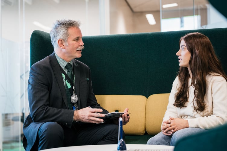 Lloyds International mortgage manager Franzy Germishuys talks to a customer