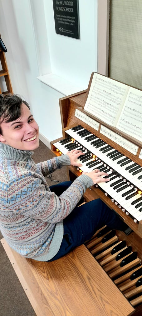 Current organ scholar Aaran Fleet at the new instrument