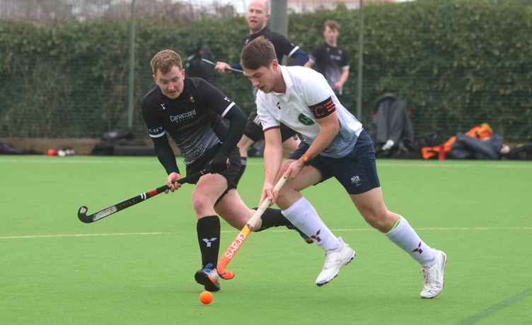 Eddie Caley of Vikings A (left) attempts to close down Bacchas A's Elliot Reid during the pair's Men's Premiership clash at the weekend (Photo: Paul Hatton)