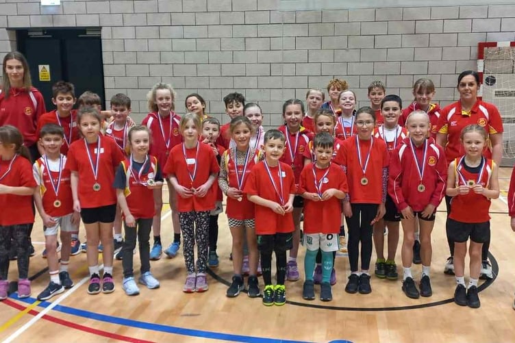 The Manx Harriers team with their medals after finishing second last weekend