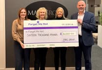Douglas firm raises £16,000 for Isle of Man dementia charity
