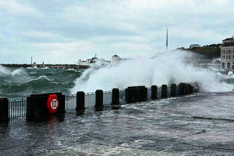 Waves crash over Douglas promenade