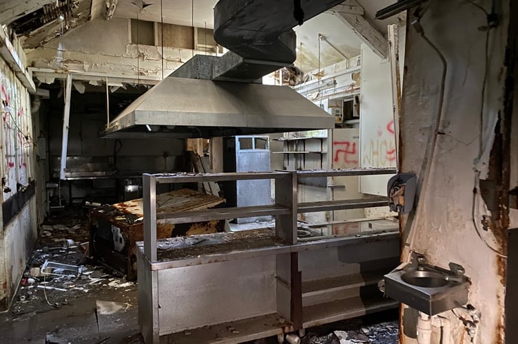 Graffiti on the wall of the hotel kitchen