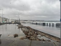 Wall collapses as waves force car park to shut