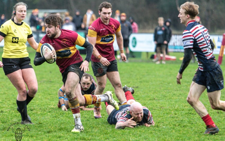 Matty Wood makes a rare Douglas escape during Saturday's clash at Port-e-Chee (Photo; Richard Ebbutt)
