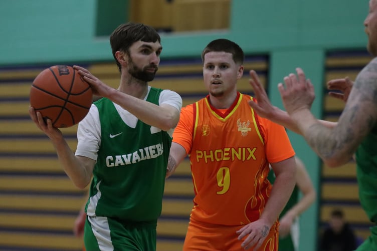 Southern Phoenix Connor Moughtin defends Cavaliers ball handler Andy Cregeen. Phoenix built momentum in the second half to overcome Cavaliers 72-61 this week (Photo: Martin Dunne)