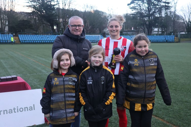 Canada Life's Stephen Watterson presents the Player of the match award to Peel's Sarah Wignall