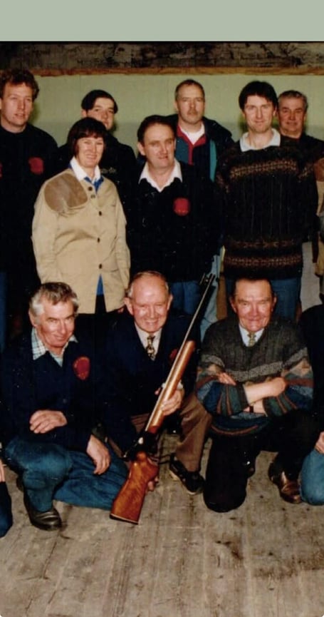 Ronnie Fairbairn (front and centre, holding the rifle) with club members at the Sulby v Cossacks derby match in December 1998