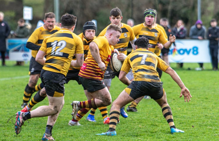 Douglas Celts' rejuvenated front-row man Aaron Mason highlights the colour clash surrounded by six Vagabonds defenders during last weekend's Manx Cup clash at Port-e-Chee (Photo: Richard Ebbutt)