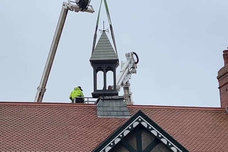 Lift off: The station belfry is freed from the roof