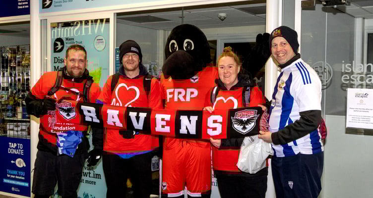The group of Wythenshawe FC fans pictured with the FC Isle of Man mascot at the Sea Terminal after reaching the island on Friday