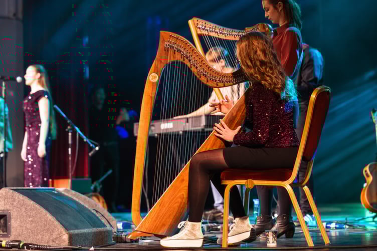 Playing the harp