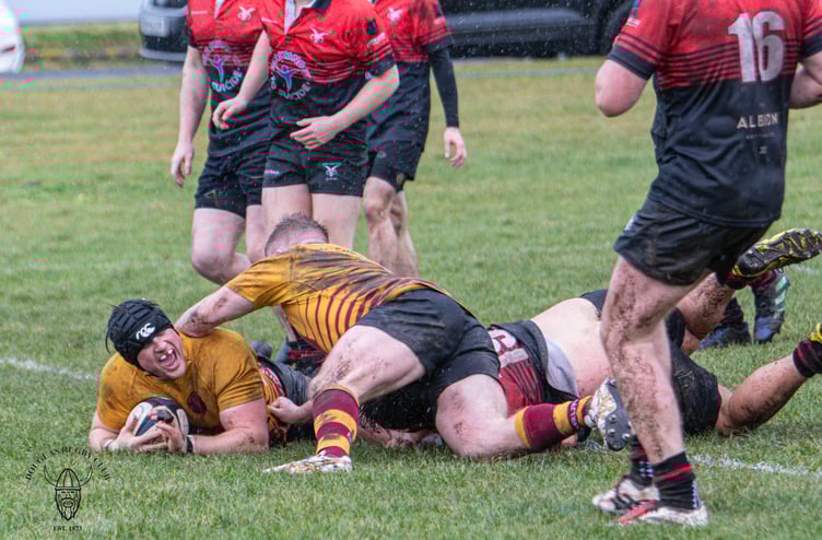 Mark Oldfield dives over to score one of his two tries for Douglas Celts against Ramsey on Saturday afternoon (Photo: Richard Ebbutt)