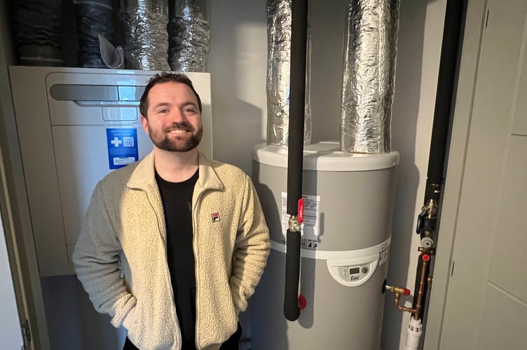 Council leader Devon Watson with on the air source heat pumps