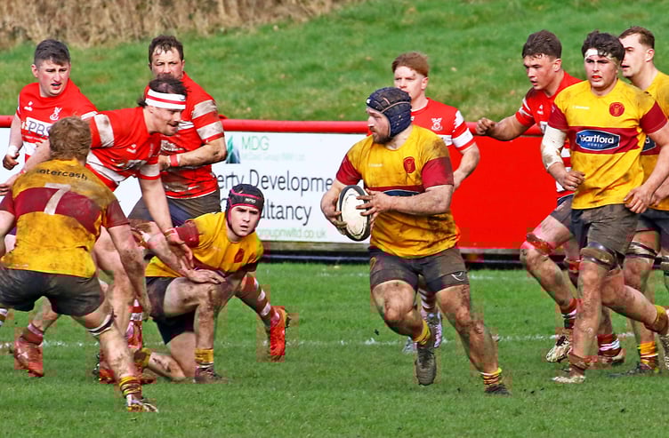 Simon Hoddinott on a charge for Douglas against Vale of Lune on Saturday afternoon (Photo: Tony North)