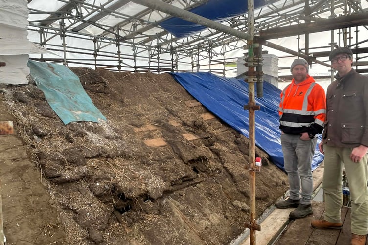 John Skillen of Sulbrick Conservation pictured with John-Paul Walker, MNH historic buildings architect on the scaffolding at Harry Kelly’s Cottage