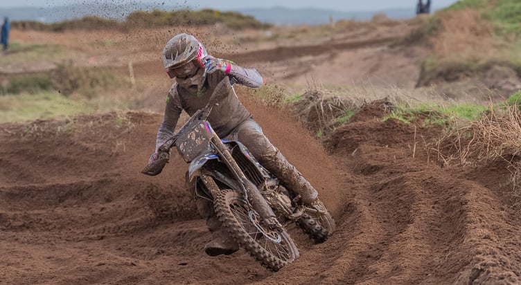 Beau Brown coolly raises his left hand to his goggle roll-off in mucky conditions at Ballagarraghyn on Sunday (Hagar Photography)