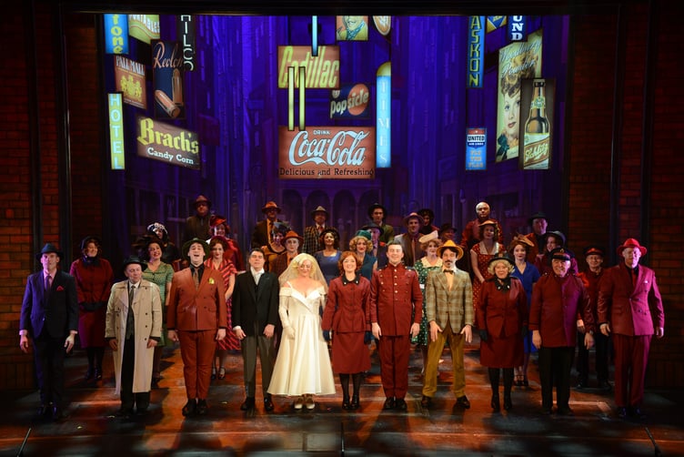 The full cast of Guys and Dolls at the end of the show