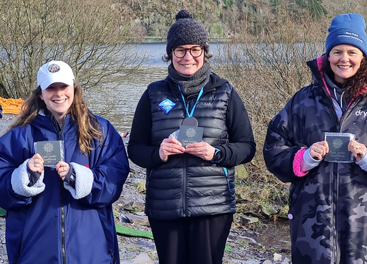 Carole Laporte (centre) on the women's podium after winning the 1km race at the recent 2026 Welsh Winter Swim