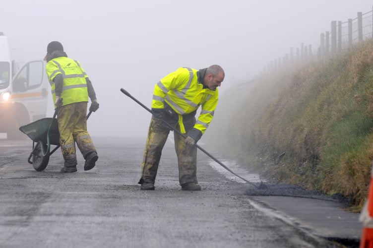 Previous work being completed on the A18 Mountain Road by DoI crews ahead of the TT