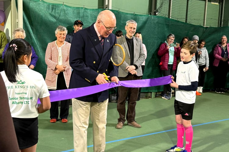 His Excellency Lieutenant Governor Sir John Lorimer cuts the ceremonial ribbon to officially reopen the indoor court at Albany