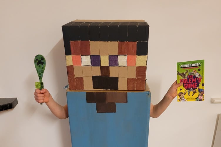 Brandon, 8, as Minecraft Steve with his wooden spoon decorated as a Minecraft Creeper