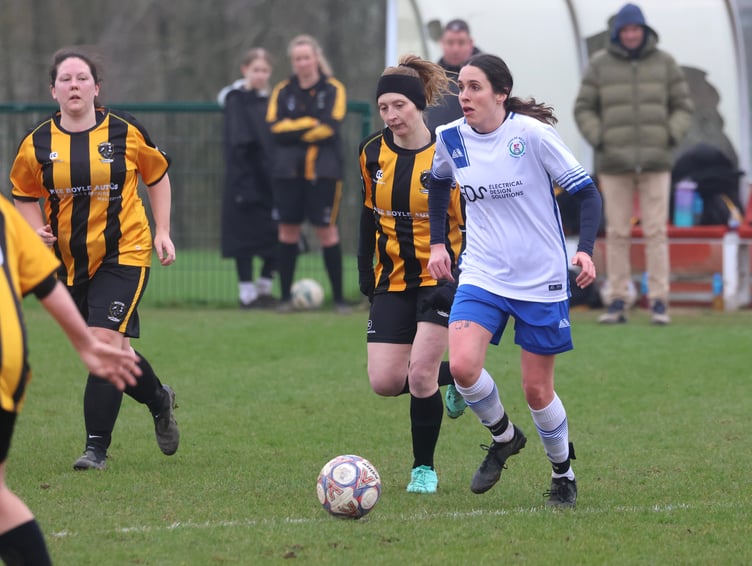 Douglas Royal's Kayleigh Georgeson attempts to escape the attentions of Rushen Utd's Michelle Blythe during Sunday's clash (Photo: Paul Hatton)