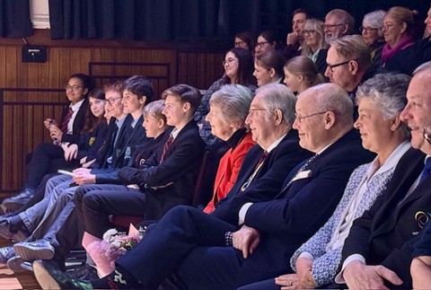 Special guests and students watch on