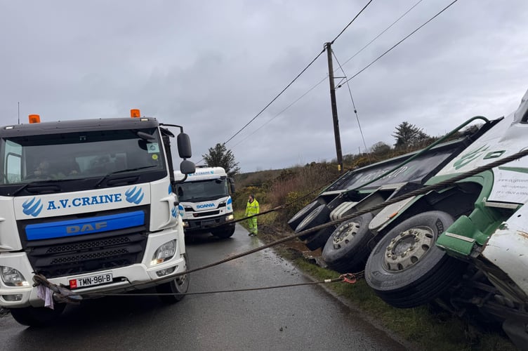 The stranded wagon is recovered from the ditch