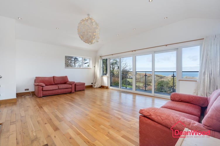 The spacious living room with sea views